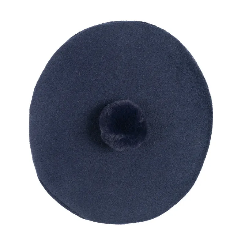 Basco blu con pompon per neonata